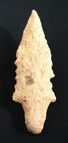 Bifacially worked neolithic arrowhead made from quartzite